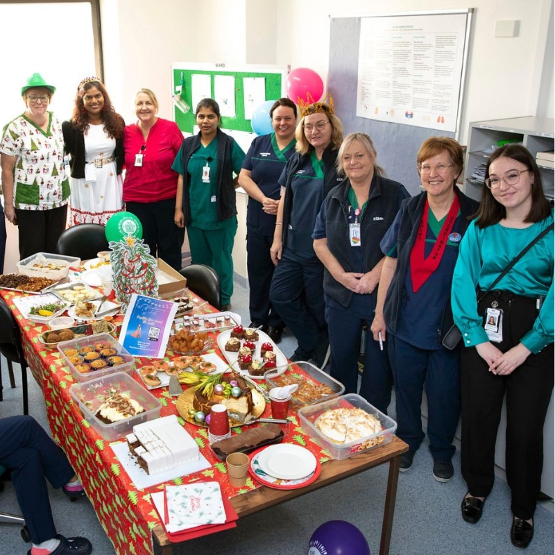 alt='TLT-Host_Hospital ward staff gathered'